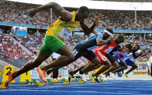 Jamaica's Usain Bolt (L) competes in the